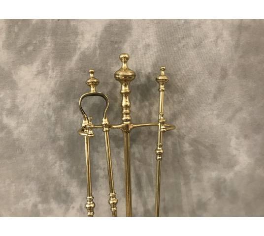 Brass fireplace servant from the 19th century