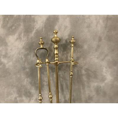 Brass fireplace servant from the 19th century