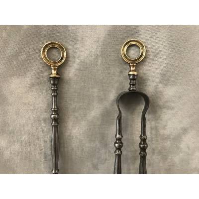 Set of a shovel and a chimney clamp in iron and bronze from the 19th century