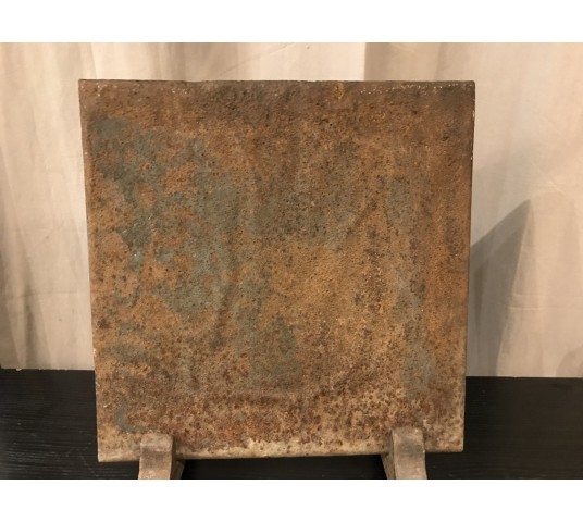 Small antique fireplace plate at the end of 18 th