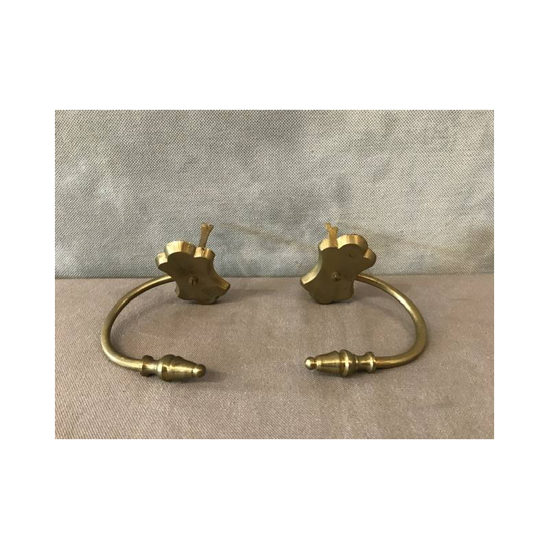 Pair of old brass fireplace hooks from the 19th century