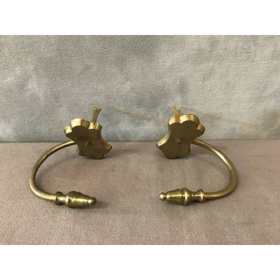 Pair of old brass fireplace hooks from the 19th century