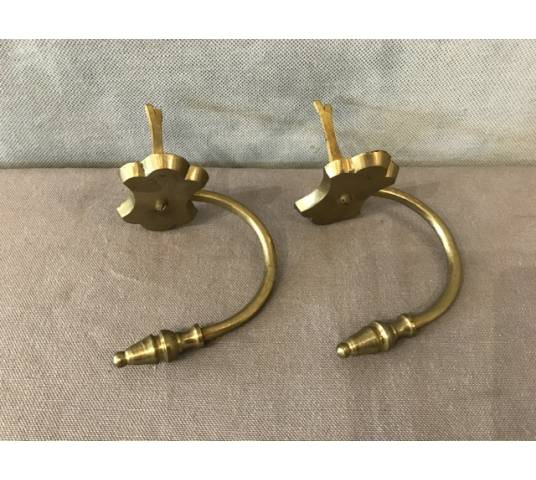 Pair of old brass fireplace hooks from the 19th century