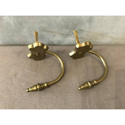 Pair of old brass fireplace hooks from the 19th century