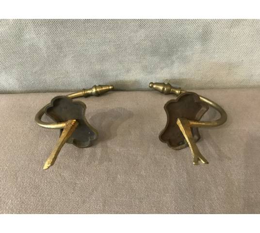Pair of old brass fireplace hooks from the 19th century