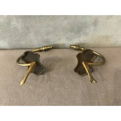 Pair of old brass fireplace hooks from the 19th century