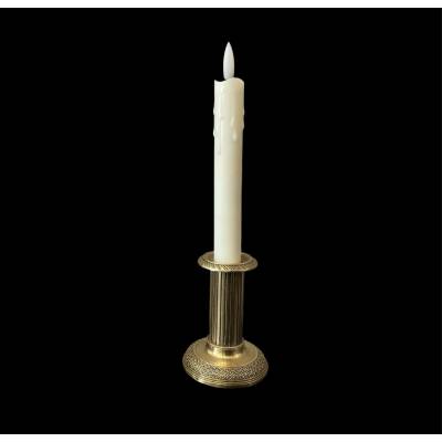 Small old bronze candle holder from the 19th century in Louis XVI style