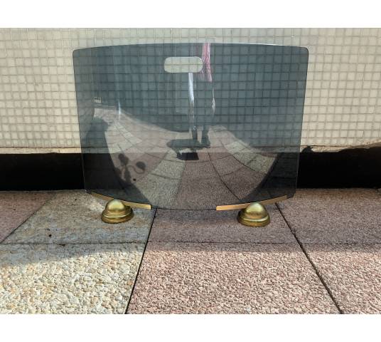 Smoked and curved glass fire screen from the 1970s