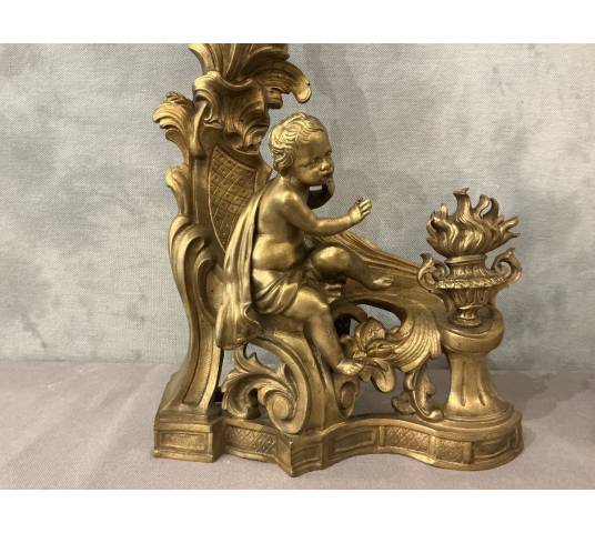 Pair of andirons, decorated with a fire motif in gilt bronze, dating from the 19th century