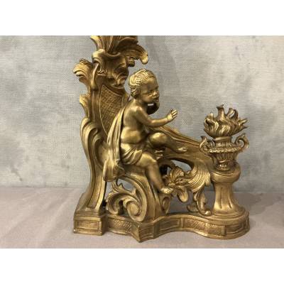 Pair of andirons, decorated with a fire motif in gilt bronze, dating from the 19th century
