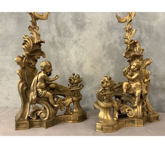 Pair of andirons, decorated with a fire motif in gilt bronze, dating from the 19th century