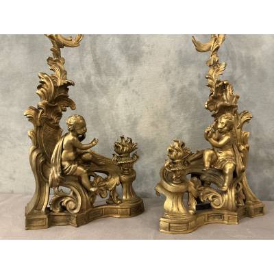 Pair of andirons, decorated with a fire motif in gilt bronze, dating from the 19th century