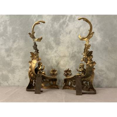Pair of andirons, decorated with a fire motif in gilt bronze, dating from the 19th century