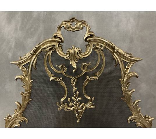 Pare feu écran de cheminée en bronze poli d'époque 19 ème de style Louis XV