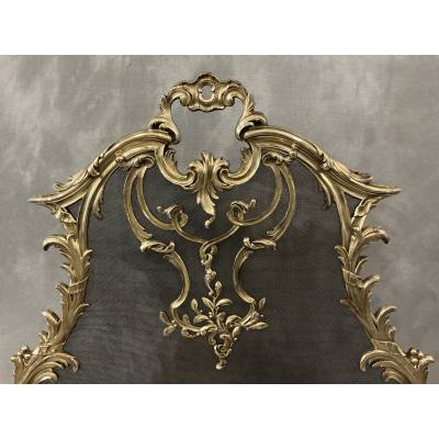 Pare feu écran de cheminée en bronze poli d'époque 19 ème de style Louis XV