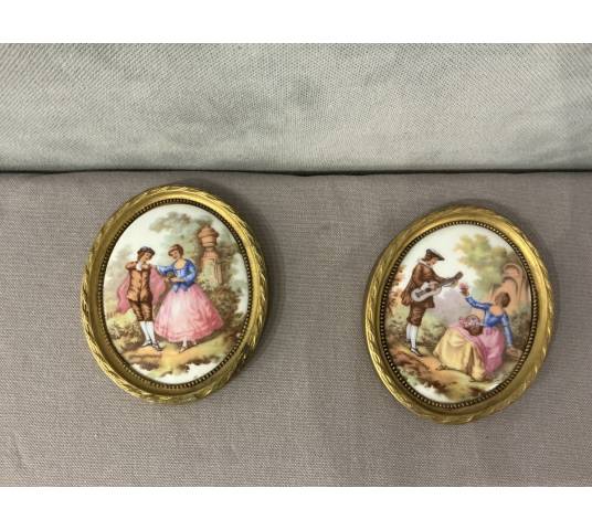 Pair of small 20th-century gilt brass and porcelain frames