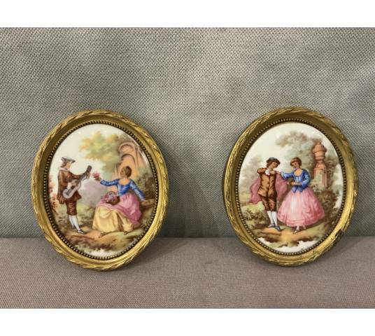 Pair of small 20th-century gilt brass and porcelain frames
