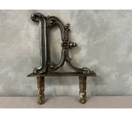 Polished cast iron foot scraper from the 19th century