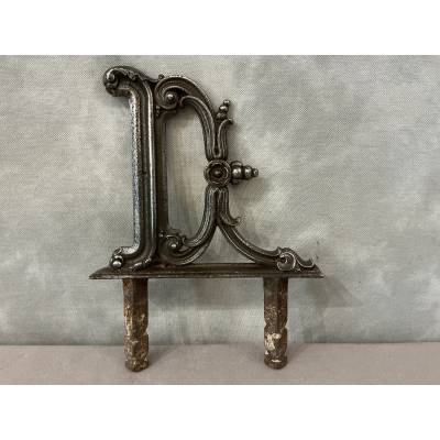 Polished cast iron foot scraper from the 19th century