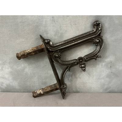 Polished cast iron foot scraper from the 19th century