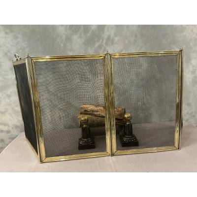 Antique polished brass fireplace screen from the 19th century