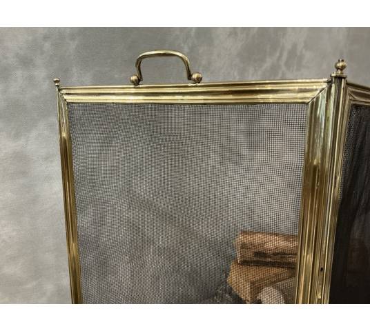 Antique polished brass fireplace screen from the 19th century