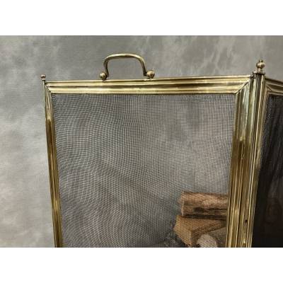 Antique polished brass fireplace screen from the 19th century
