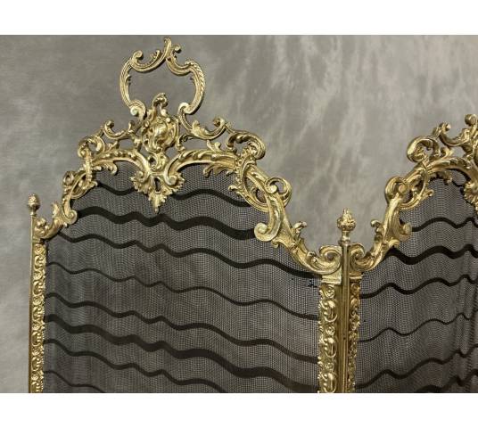 Antique pressed brass fireplace screen from the 19th century