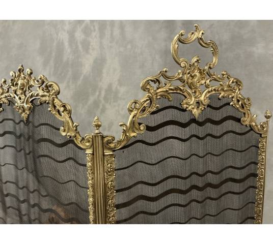Antique pressed brass fireplace screen from the 19th century