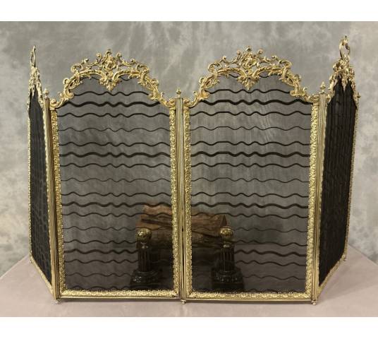 Antique pressed brass fireplace screen from the 19th century