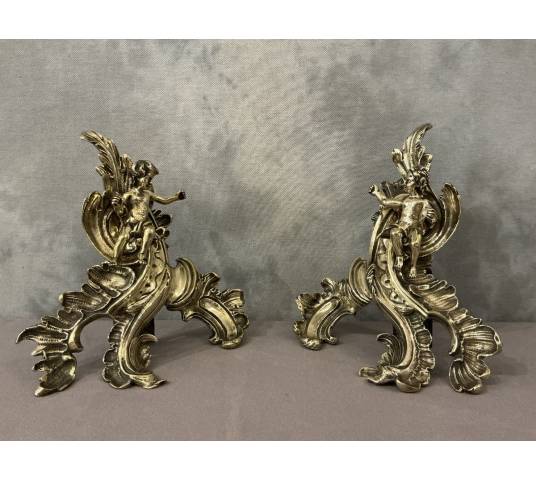 Pair of bronze andirons decorated with cherubs, dating from the 19th century