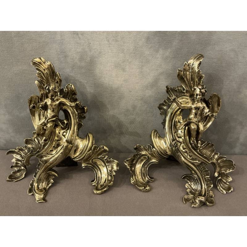Pair of bronze andirons decorated with cherubs, dating from the 19th century
