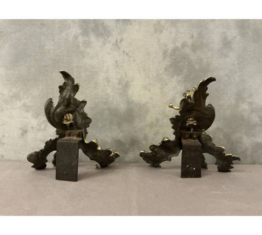 Pair of bronze andirons decorated with cherubs, dating from the 19th century