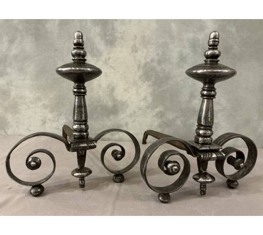Beautiful pair of antique wrought iron andirons from the early 19th century