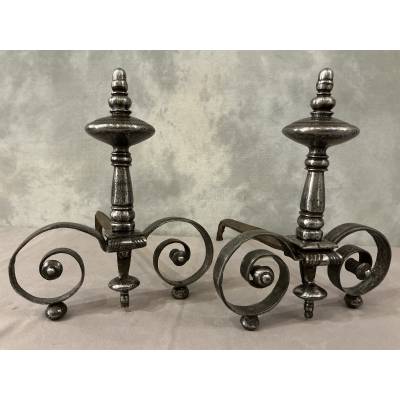 Beautiful pair of antique wrought iron andirons from the early 19th century