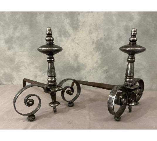Beautiful pair of antique wrought iron andirons from the early 19th century