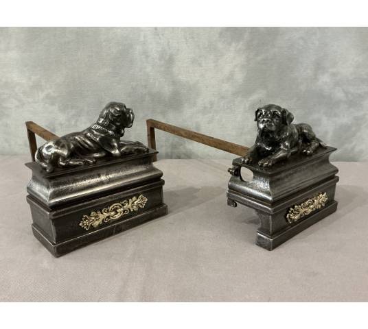 Pair of antique cast iron dog-decorated andirons from the 19th century