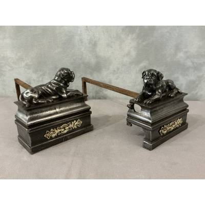 Pair of antique cast iron dog-decorated andirons from the 19th century