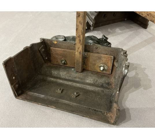 Pair of antique cast iron dog-decorated andirons from the 19th century