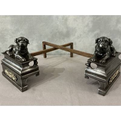 Pair of antique cast iron dog-decorated andirons from the 19th century