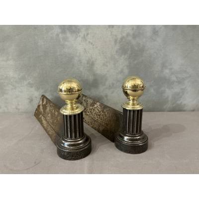 Pair of antique cast iron and brass andirons from the 19th century