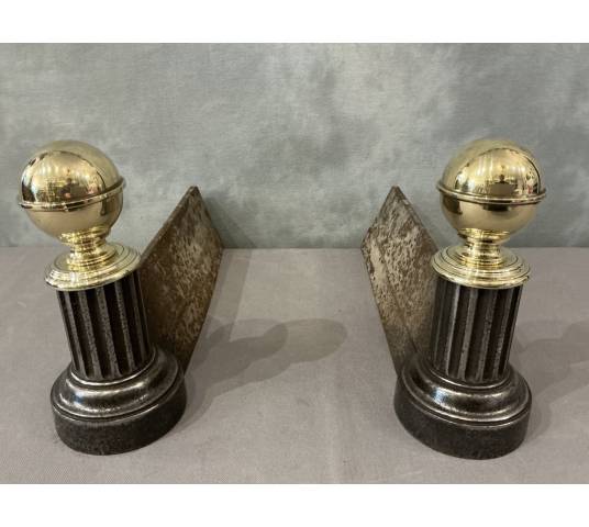 Pair of antique cast iron and brass andirons from the 19th century