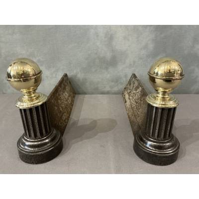 Pair of antique cast iron and brass andirons from the 19th century