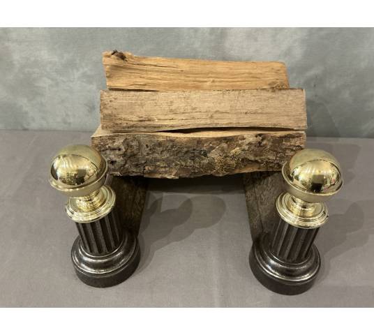 Pair of antique cast iron and brass andirons from the 19th century