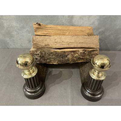 Pair of antique cast iron and brass andirons from the 19th century