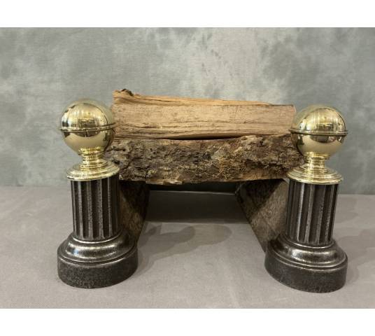 Pair of antique cast iron and brass andirons from the 19th century
