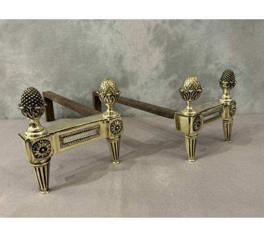 Antique polished bronze andirons from the 18th century Louis XVI period