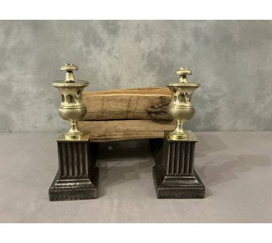 Pair of antique cast iron and brass andirons from the 19th century