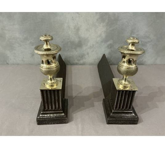 Pair of antique cast iron and brass andirons from the 19th century