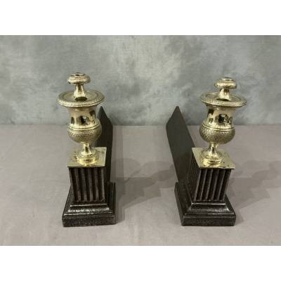 Pair of antique cast iron and brass andirons from the 19th century